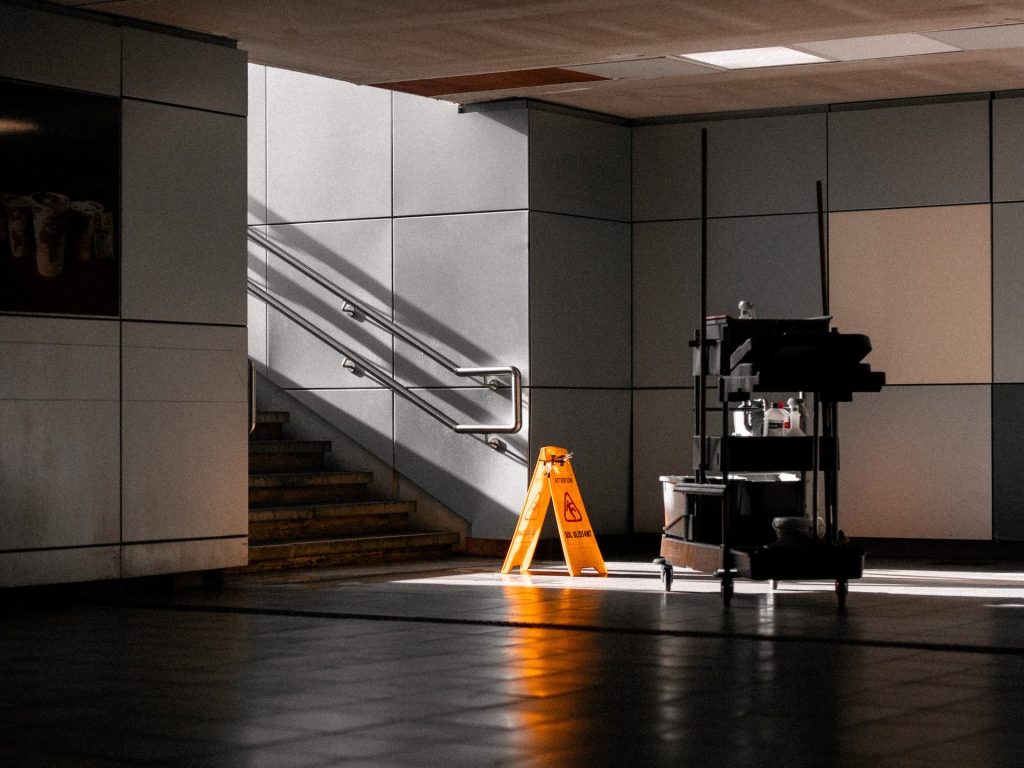 Wet Floor Sign in Underground Hall